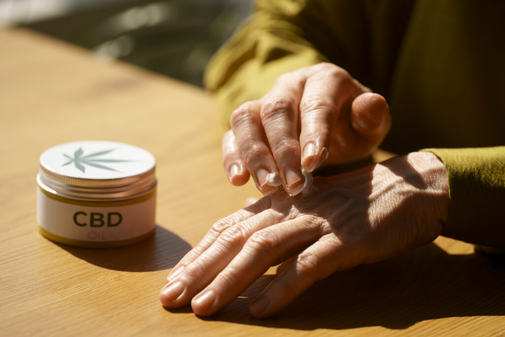 close up woman using cbd cream